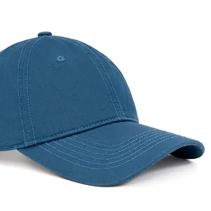 Navy cotton baseball cap featuring a wide curved brim for a face-slimming outdoor look