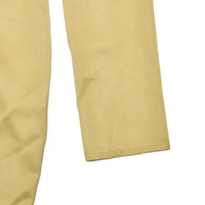 Close-up of khaki satin dress sleeve showing high-quality stitching and smooth fabric texture