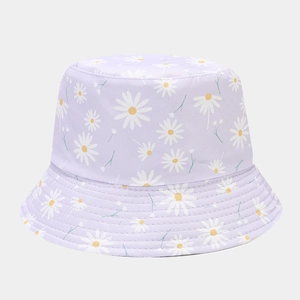 Detailed view of light purple sun hat with white daisy prints and reinforced brim stitching