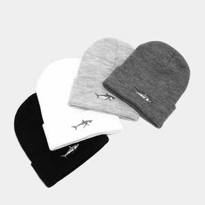 Shark embroidered knit beanies for men and women available in four classic neutral colors