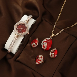 Exquisite gold-tone quartz watch and jewelry set with red gems and pearls in a display box