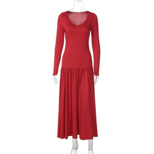 Detail view of red V-neck long sleeve dress with A-line cut and waist pleats
