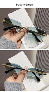 Detail of rimless butterfly sunglasses with green gradient lenses and gold cheetah temples