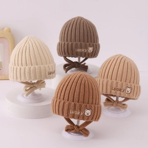 Lucky bear knitted baby winter earflap hats in beige, brown, tan and caramel colors