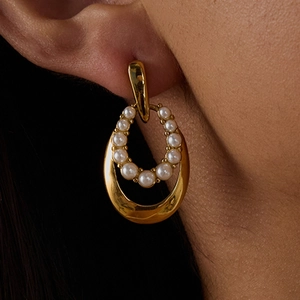 Luxurious gold double-hoop earrings featuring white pearl inlay and polished titanium finish