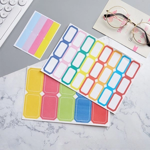Close-up of colorful border adhesive labels for office filing on marble desk background