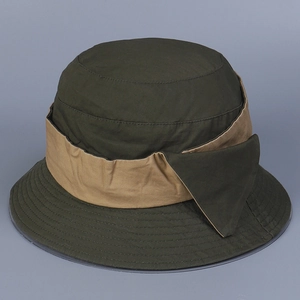 Detailed view of dark olive bucket hat with khaki bow and reinforced stitching lines