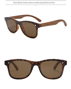 Detail of tortoise frame sunglasses with natural zebra wood temples and tea lenses