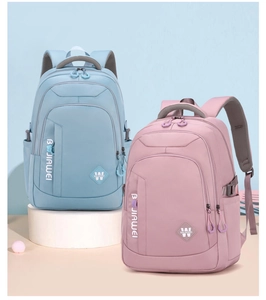 Detail of light blue and pink purple waterproof nylon backpacks on minimalist stands