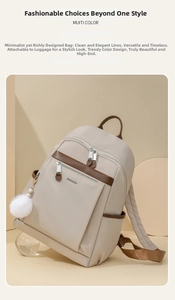 Detail of beige nylon backpack with brown leather trim and back luggage trolley strap