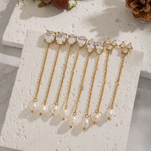 Gold-plated tassel earrings with geometric zircon studs and white freshwater pearls