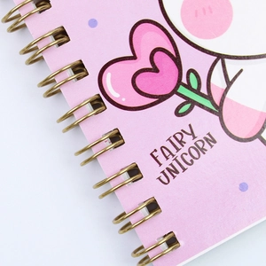 Pink Fairy Unicorn cartoon spiral notebook with gold wire binding and paper texture