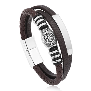 Detail view of vintage Viking leather bracelet with Nordic rune barrel bead and magnetic clasp