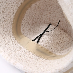 Winter faux shearling bucket hat for women in beige with adjustable drawstring lining