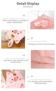 Close-up of pink pig coral fleece hand towel with embroidery and hanging loop