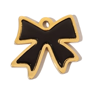 Detailed view of a black and gold bow pendant featuring smooth enamel and metallic finish