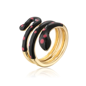 Macro detail of snake ring featuring black enamel finish with pink polka dots on gold band