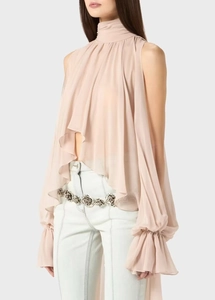 Detail of light pink chiffon halter top featuring natural pleats and airy fabric texture