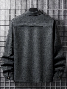Rear view of mens dark gray corduroy jacket showing back stitching and metal cuff buttons