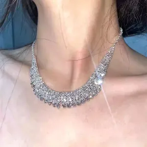 Detail of silver multi-row crystal tassel necklace with sparkling rhinestone fringe
