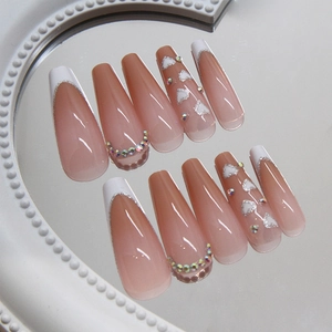 French tip coffin fake nails with glitter hearts and rhinestones on mirror surface