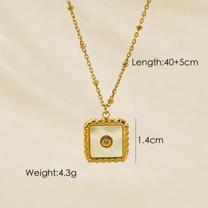 Detail view of a gold square pendant with white shell inlay, showing 1.4cm size and 4.3g weight