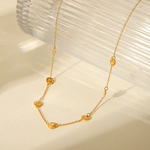 18K gold plated stainless steel necklace featuring textured round discs on a delicate chain