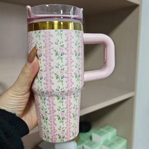 Insulated 304 stainless steel tumbler with pink floral pattern and portable handle