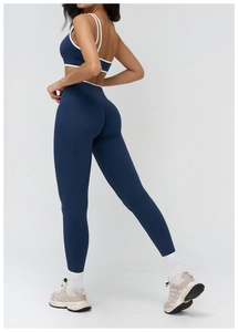 Close-up of high-waist blue yoga leggings showing seamless compression and lift effect