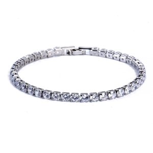 Detailed macro view of silver tennis bracelet with AAA cubic zirconia in 4-prong setting