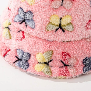 Pink plush bucket hat with colorful butterfly patterns for winter warmth and style