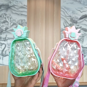 Detail showing creative pineapple-shaped water bottles with adjustable straps in mint and pink