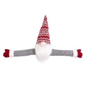 Christmas gnome tree topper with long arms and knit hat for holiday home decoration