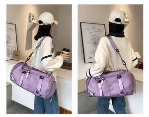 Detail view of lightweight lavender nylon travel bag with shoulder strap and large capacity