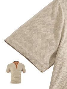 Detail of waffle knit fabric on men's beige and orange henley shirt with zip collar
