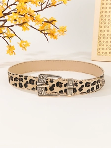 Detail of leopard print belt with ornate gold buckle and metallic beaded edge accents