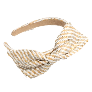 Minimalist woven straw headband with bow detail in beige and white on white background