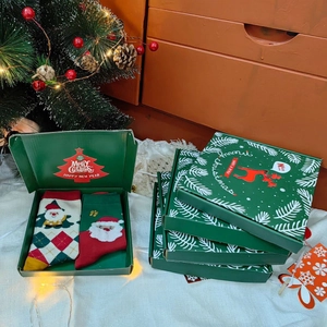 2-pack Christmas cotton socks set in a green gift box with festive Santa Claus patterns