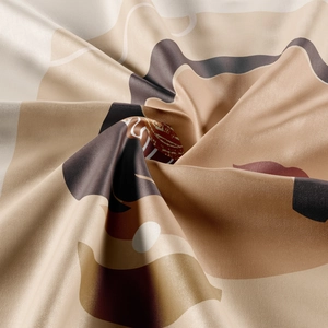 Macro shot of bohemian tapestry fabric with silky satin texture and abstract geometric print