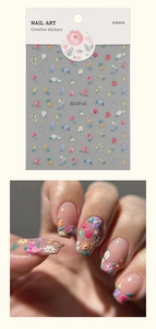 Detailed 5D relief floral nail stickers featuring pink roses and white daisy patterns