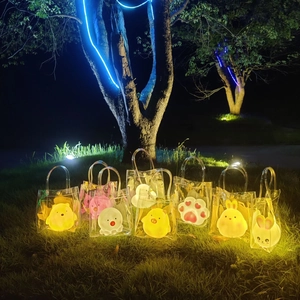 Luminous cartoon night lights in clear bags including yellow chick and pink rabbit designs