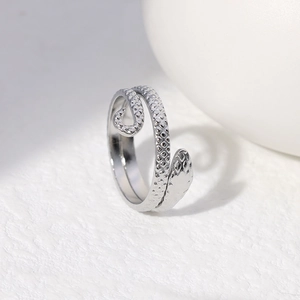 Detailed view of adjustable snake ring showing intricate scales and silver texture