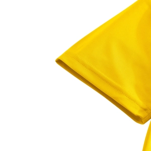 Close-up of yellow knit mesh polo shirt cuff showing detailed stitching and fabric texture