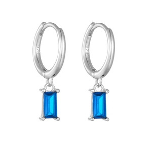 Detail view of S925 sterling silver stamp and emerald cut blue zircon on dangle earrings