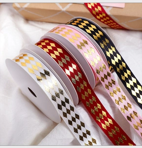 Detail of four-color glitter diamond ribbon rolls for gift wrapping and DIY bouquets