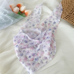 Detail of lightweight silk scarf with purple butterfly patterns and DN&KW letter prints