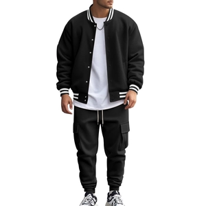 Detail of black baseball jacket and cargo pants set with white striped cuffs and collar