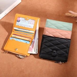 Flat lay of slim leather wallets in multiple colors showing card slots and compartments