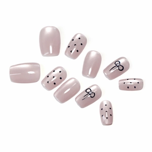 Press-on nail set with pearlescent pink purple cat-eye finish, black dots and 3D bows