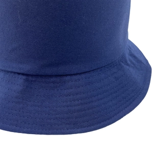 Detailed macro view of navy blue bucket hat featuring twill fabric and parallel stitching